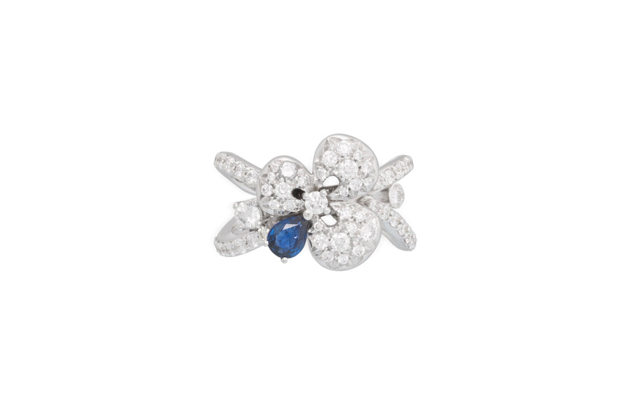 Ischia ring in 18kt white gold set with white diamonds (0.66 carats) and one pear shape blue sapphire (0.30 carats)