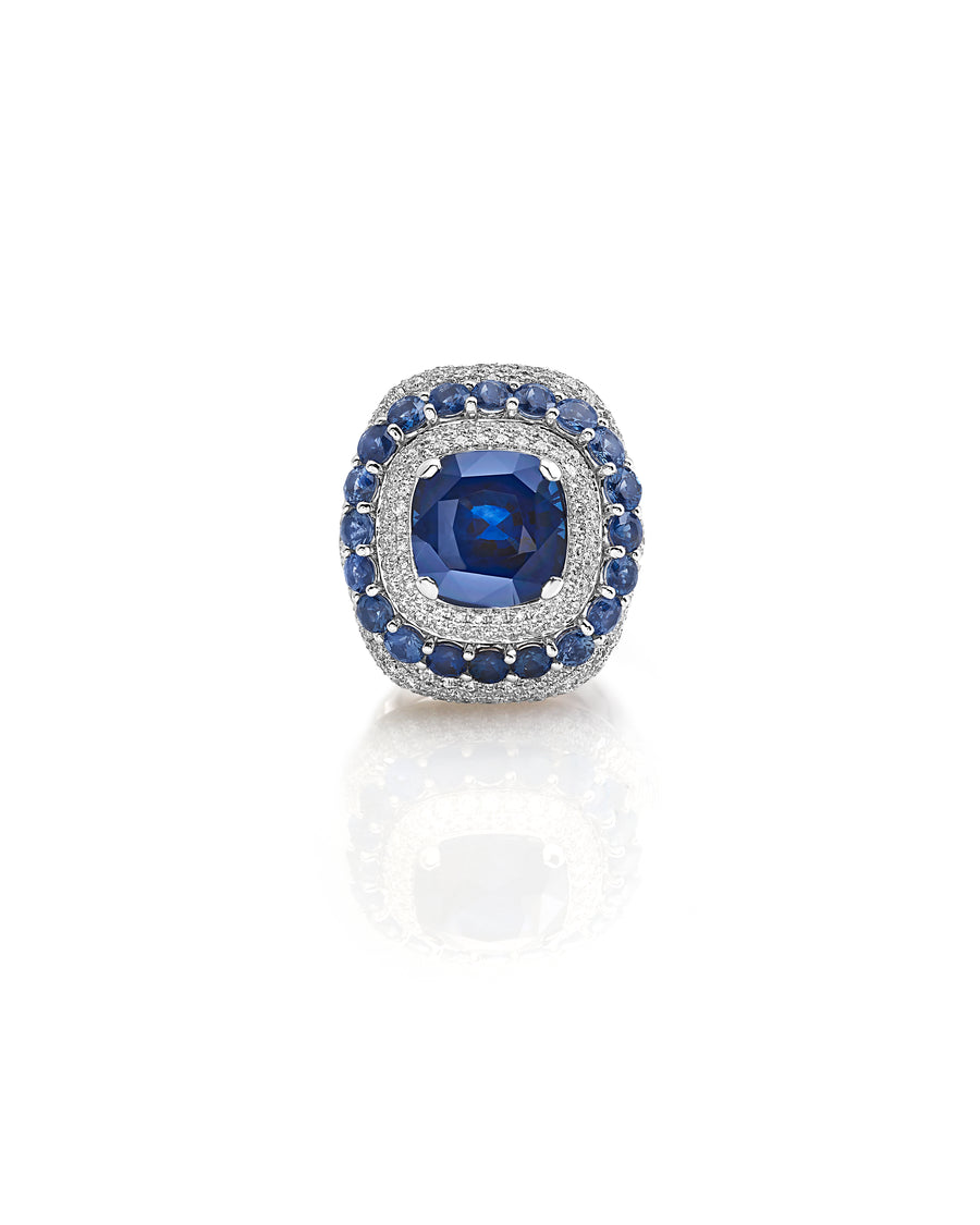 Ring in 18kt white gold set with white diamonds (1.76 cts), blue sapphires (2.98 cts), and one cushion cut blue sapphire center stone (8.92 cts)