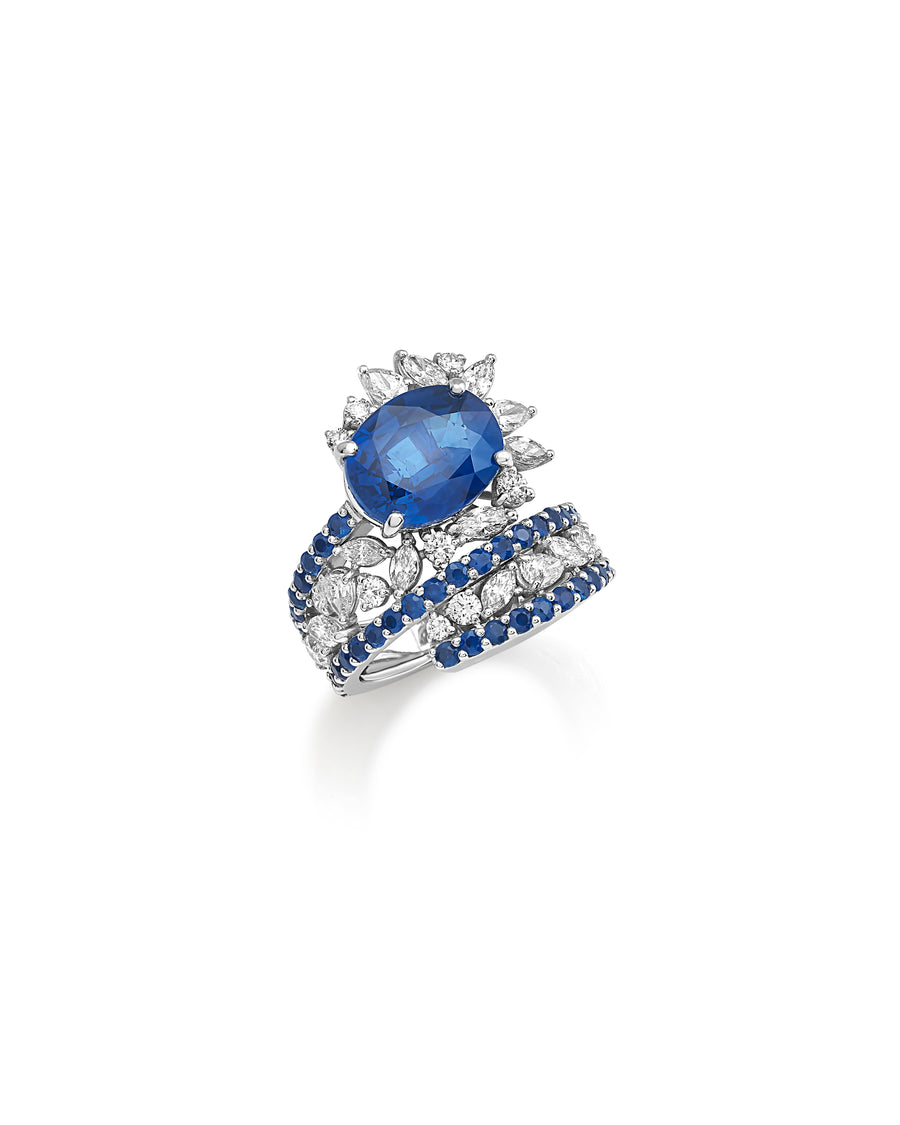 Ring in 18kt white gold set with white diamonds (2.06 cts), blue sapphires (1.71 cts), and one oval shape blue sapphire center stone (7.34 cts)