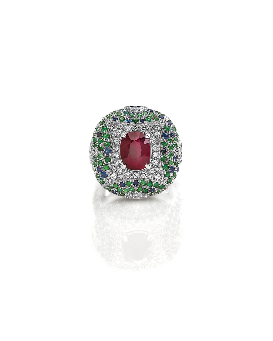 Ring in 18kt white gold set with white diamonds (0.45 cts), tsavorite (2.14 cts), blue sapphires (1.52 cts), and cushion cut ruby (3.04 cts)