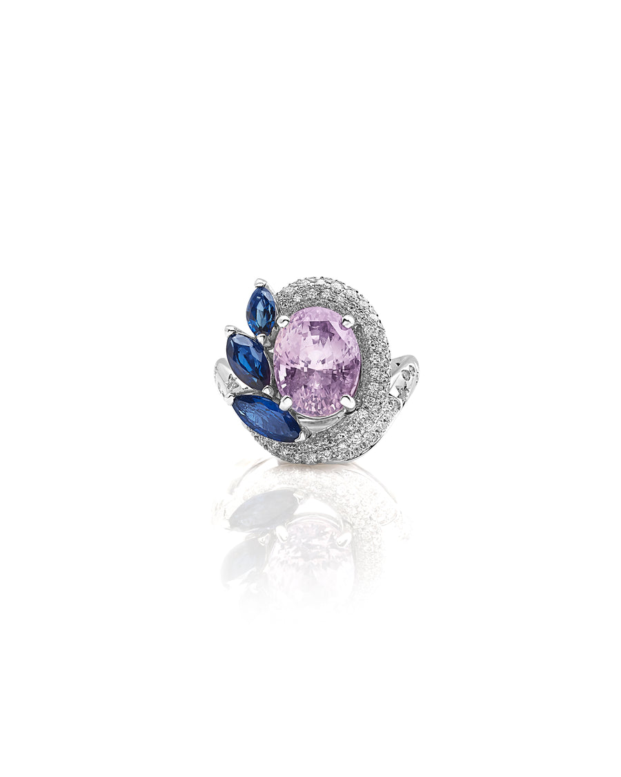Ring in 18kt white gold set with white diamonds (0.74 cts), marquise shape blue sapphires (1.55 cts), and oval shape pink (padparadscha) sapphire (5.84 cts)
