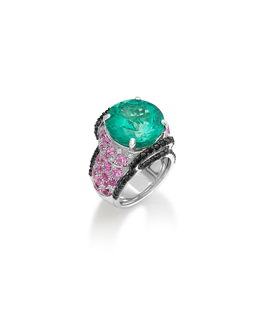 Ring in 18kt white gold set with white diamonds (0.20 cts), black diamonds (1.90 cts), pink sapphires (3.39 cts), and one round cut colombian emerald center stone (13.02 cts)