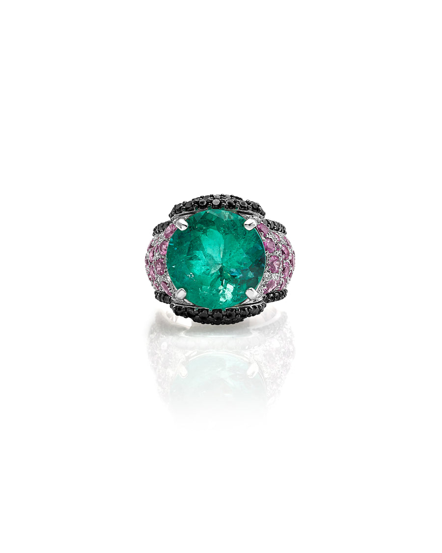 Ring in 18kt white gold set with white diamonds (0.20 cts), black diamonds (1.90 cts), pink sapphires (3.39 cts), and one round cut colombian emerald center stone (13.02 cts)