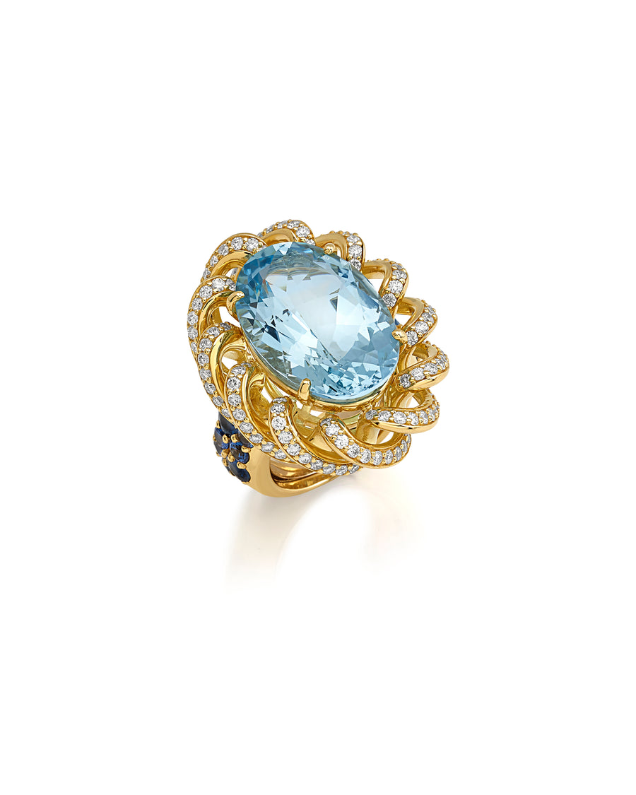 Ring in 18kt yellow gold set with white diamonds 1.70 cts), blue sapphires (1.93 cts), and oval shape aquamarine center stone (17.25 cts)