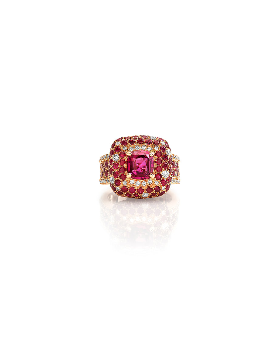 Ring in 18kt rose gold set with white diamonds (0.76 cts), rubies (3.34 cts), and one cushion cut ruby center stone (3.02 cts)