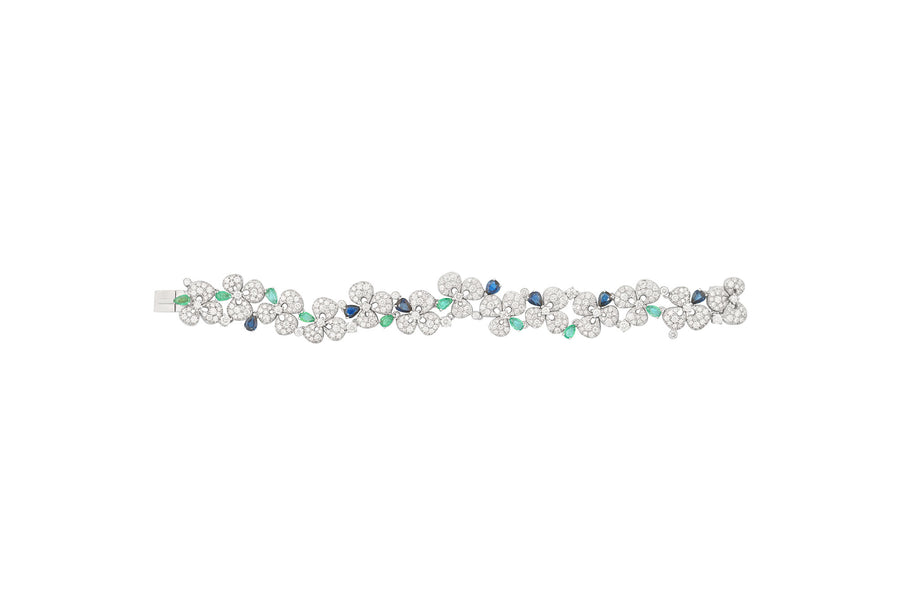 Ischia bracelet in 18kt white gold set with white diamonds (6.26 carats), blue sapphires (3.10 carats), and emeralds (1.89 carats)