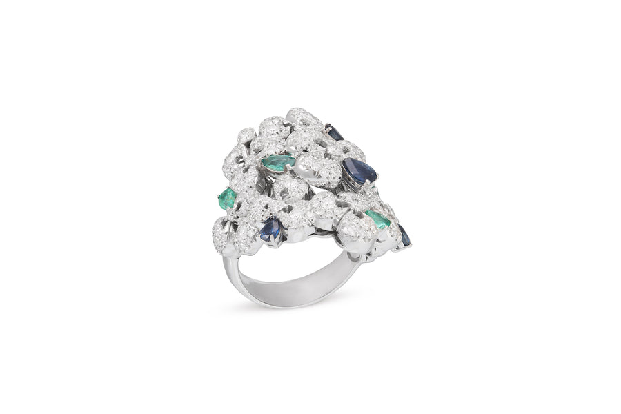 Ischia ring in 18kt white gold set with white diamonds (3.80 carats), blue sapphires (0.65 carats), and emeralds (0.65 carats)