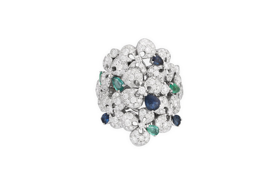 Ischia ring in 18kt white gold set with white diamonds (3.80 carats), blue sapphires (0.65 carats), and emeralds (0.65 carats)