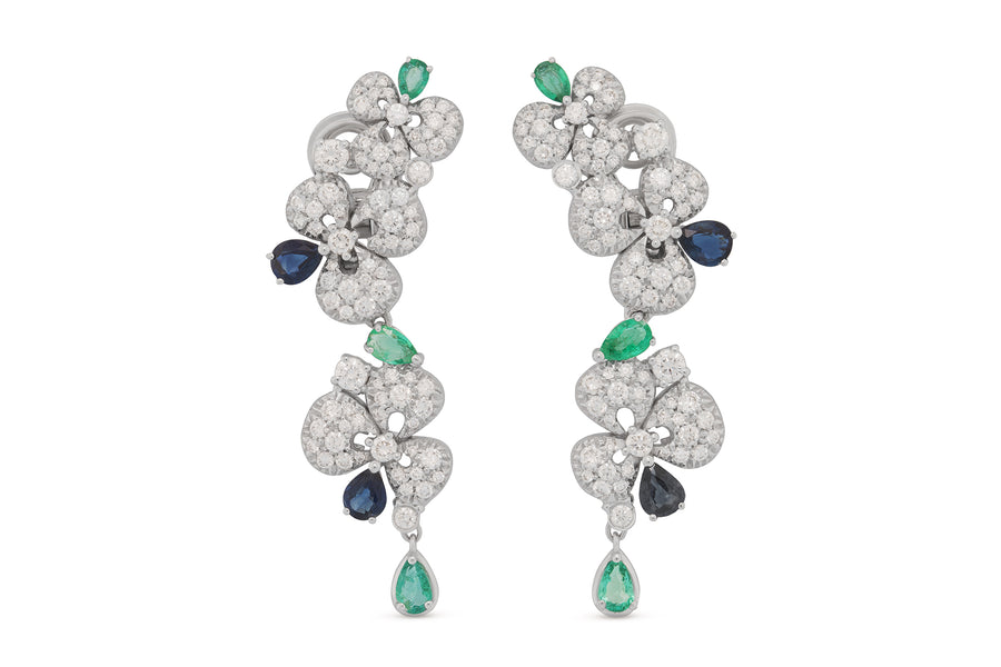 Ischia earrings in 18kt white gold set with white diamonds (2.69 carats), blue sapphires (1.57 carats), and emeralds (1.31 carats)