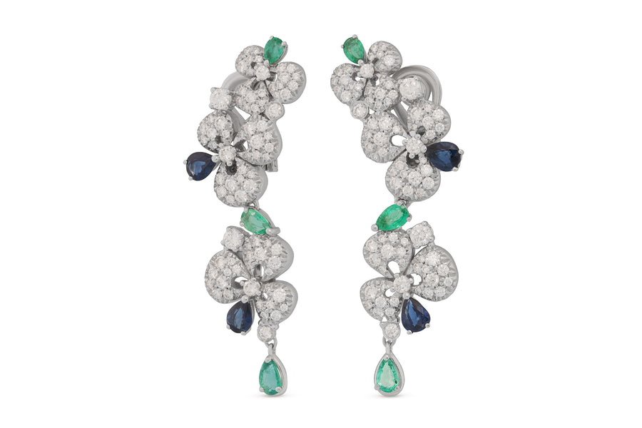 Ischia earrings in 18kt white gold set with white diamonds (2.69 carats), blue sapphires (1.57 carats), and emeralds (1.31 carats)